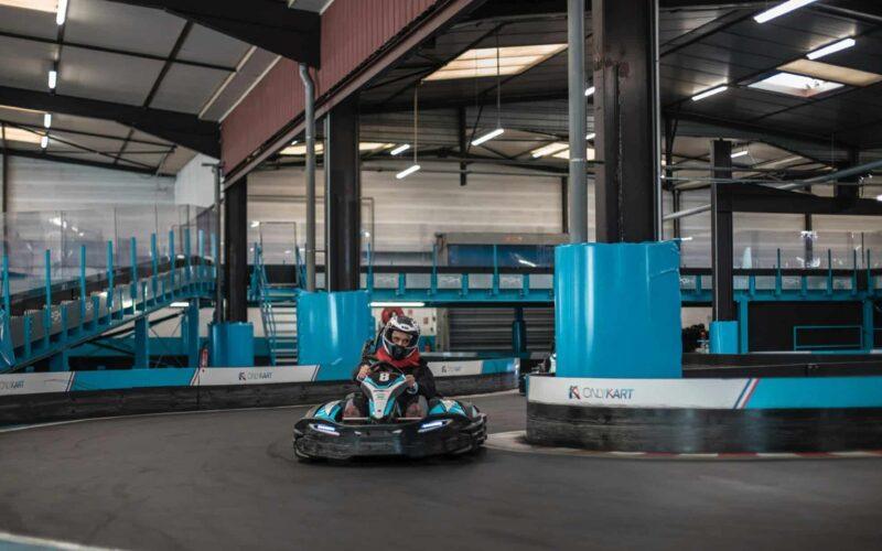 a person riding a go - kart in a building