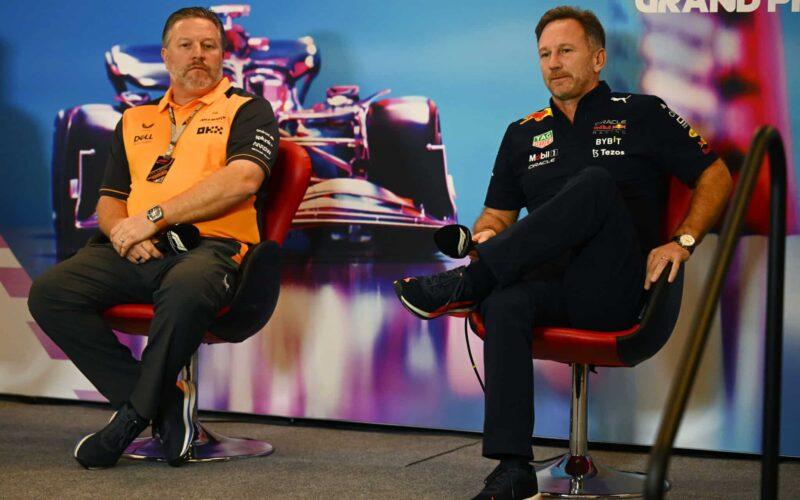 a couple of men sitting next to each other