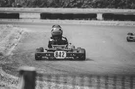 a person driving a car on a race track