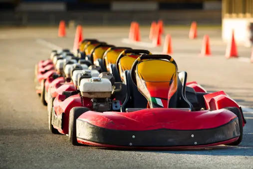a row of bumper cars sitting on top of a street
