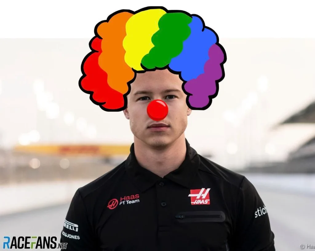 a man with a clown nose and a rainbow colored clown nose