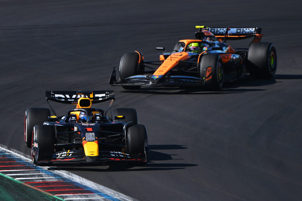 Max Verstappen of the Netherlands driving the (1) Oracle Red Bull Racing RB20 leads Lando Norris of Great Britain driving the (4) McLaren MCL38 Mercedes on track during the F1 Grand Prix of United States at Circuit of The Americas