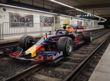 a red bull f1 car was unexpectedly spotted on madrid railway tracks, causing amusement and disbelief among fans who reacted with humor and surprise.