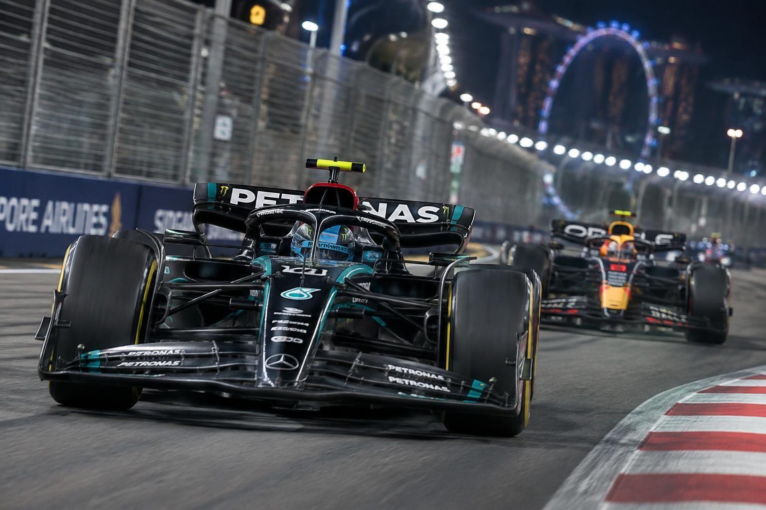 george russell sets the pace in singapore grand prix practice, while max verstappen impresses under the lights at marina bay.